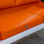 Ensemble de coussins de salon de jardin orange 60x60 cm, déhoussables et anti-UV pour fauteuils et canapés.