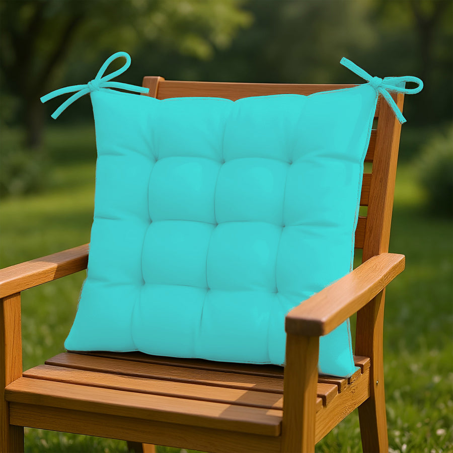 Quatre galettes de chaise 40x40 cm en tissu déperlant bleu Caraïbes pour intérieur et extérieur, avec attaches, pour fauteuils et canapés.