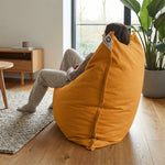 Détail tissu pouf jaune miel