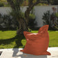Giant XXL terracotta waterproof pouf for outdoor use, featuring removable cover and soft foam filling.